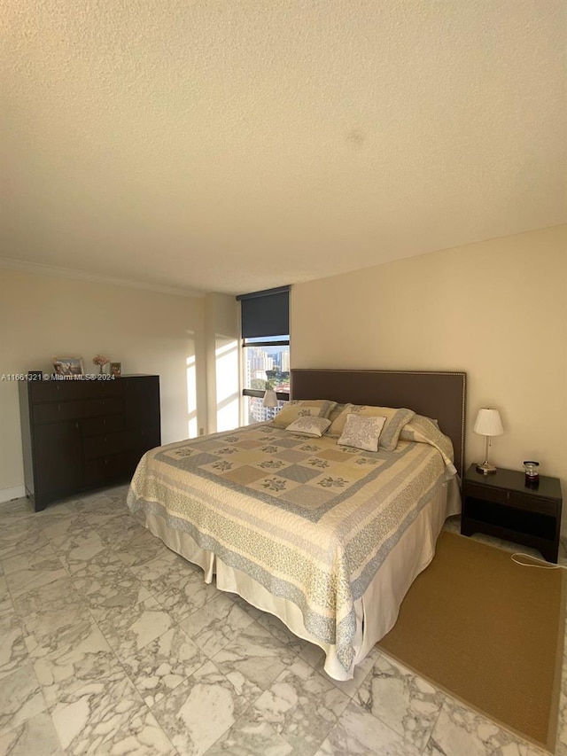 bedroom featuring a textured ceiling