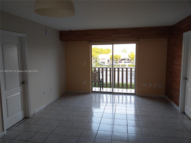 unfurnished room with light tile patterned floors