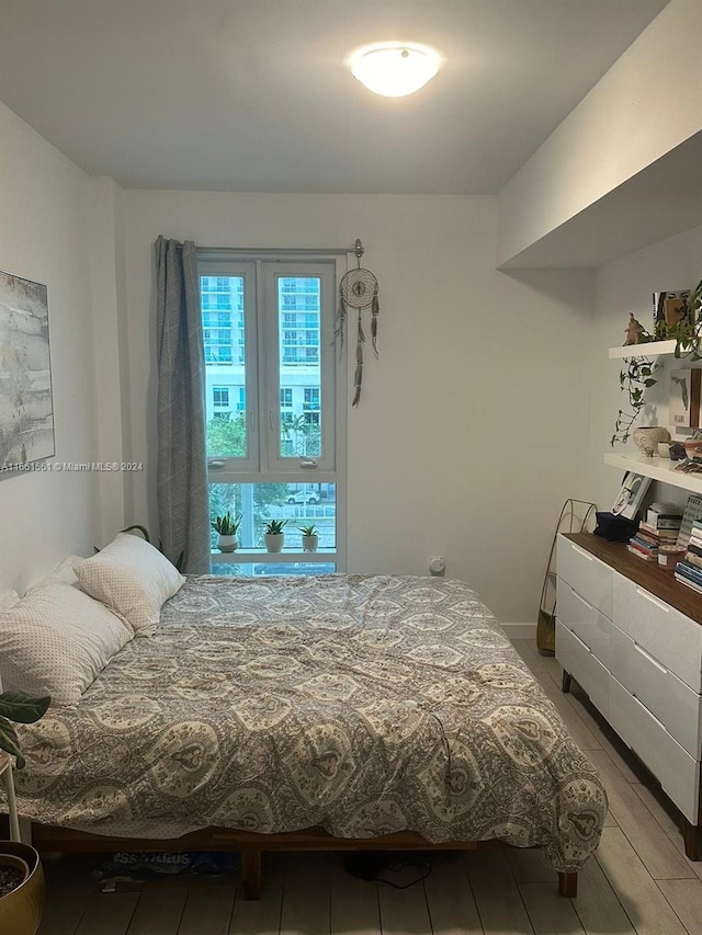 bedroom with wood-type flooring