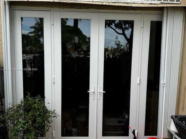 property entrance featuring french doors