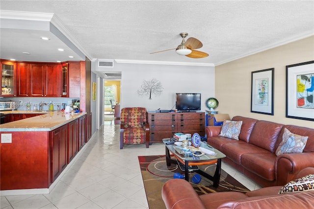 living room with ceiling fan, a textured ceiling, and crown molding