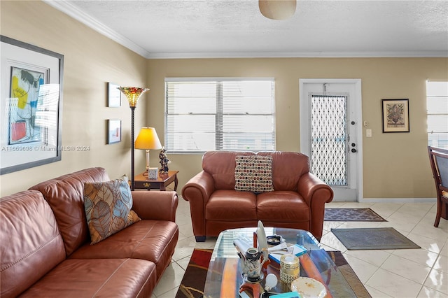 living room with a textured ceiling, a healthy amount of sunlight, crown molding, and light tile patterned floors