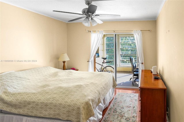 bedroom with ornamental molding, ceiling fan, hardwood / wood-style flooring, and access to outside