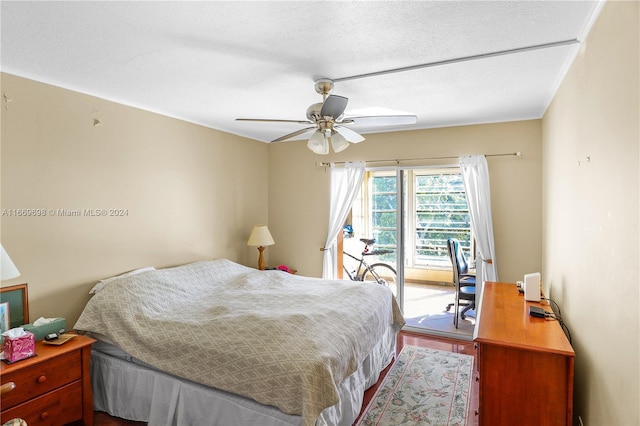 bedroom with ceiling fan, a textured ceiling, access to outside, and wood-type flooring