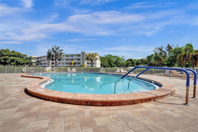 view of swimming pool with a patio