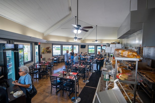 dining area featuring vaulted ceiling with beams and ceiling fan