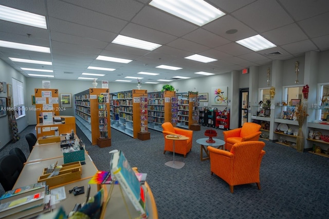 playroom with carpet and a drop ceiling