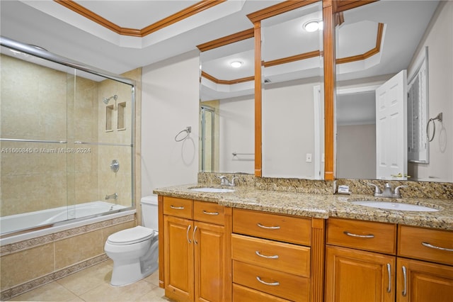 full bathroom featuring vanity, crown molding, tile patterned flooring, shower / bath combination with glass door, and toilet