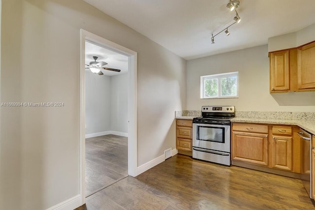 kitchen featuring light stone countertops, ceiling fan, appliances with stainless steel finishes, and dark hardwood / wood-style floors