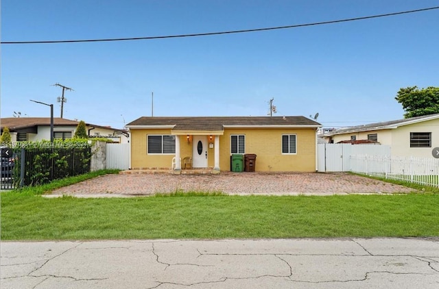 ranch-style house with a front lawn