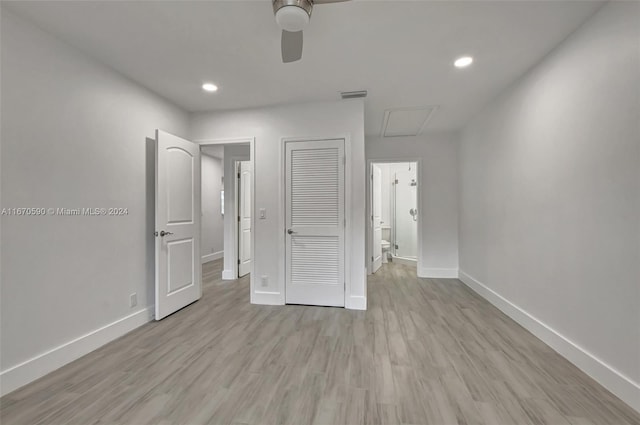 unfurnished bedroom with ceiling fan, a closet, and light hardwood / wood-style floors