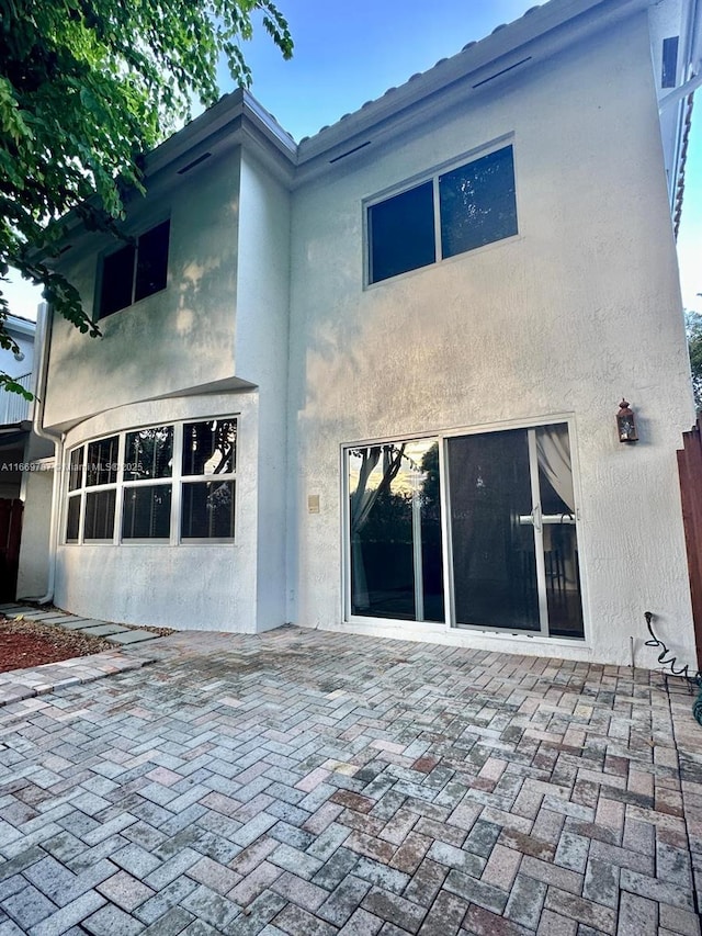 back of house featuring a patio area