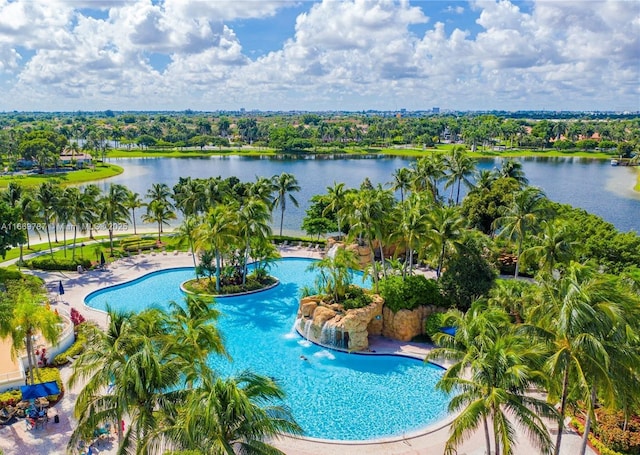 view of swimming pool featuring a patio and a water view