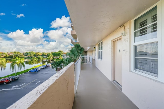 balcony featuring a water view