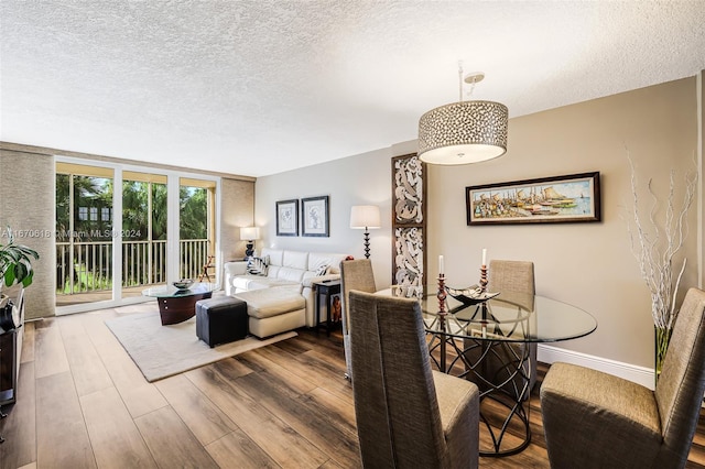 living room featuring a textured ceiling and hardwood / wood-style floors