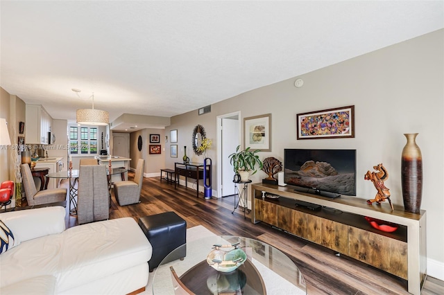 living room with dark hardwood / wood-style floors