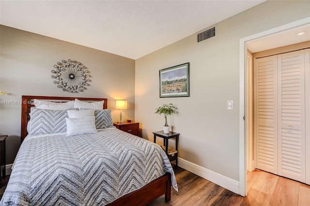 bedroom with hardwood / wood-style floors