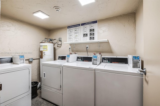 laundry room featuring washing machine and clothes dryer