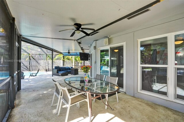 sunroom / solarium with ceiling fan