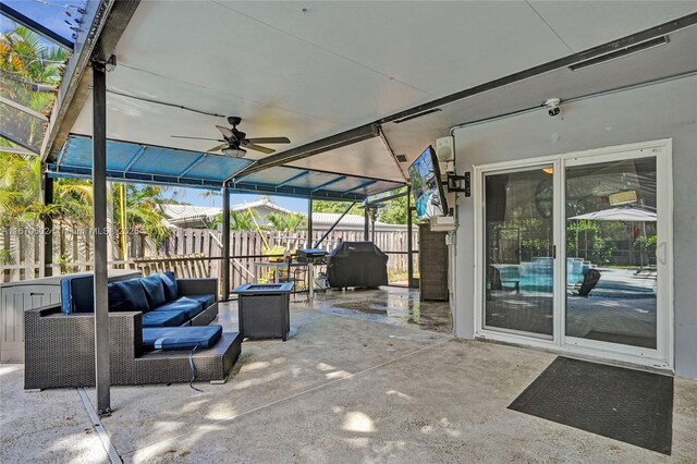 view of patio featuring area for grilling, outdoor lounge area, and ceiling fan