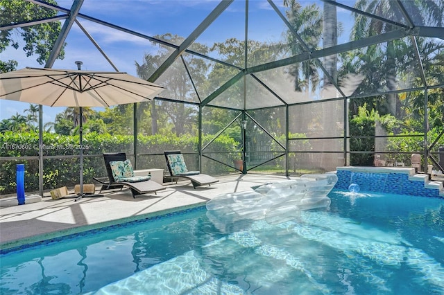 view of swimming pool featuring a lanai and a patio area