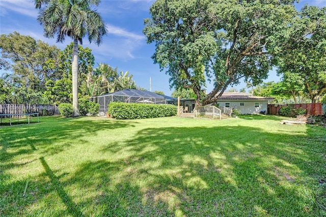 view of yard with a lanai