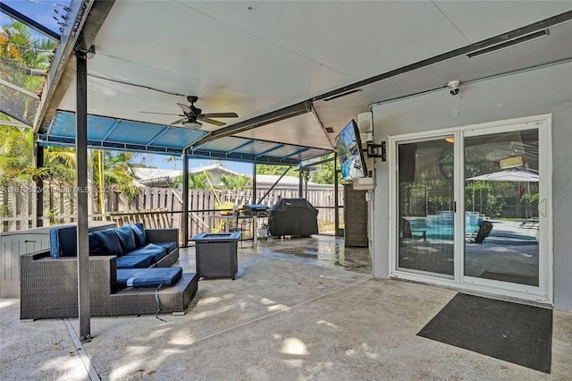 view of patio featuring an outdoor living space, area for grilling, and ceiling fan