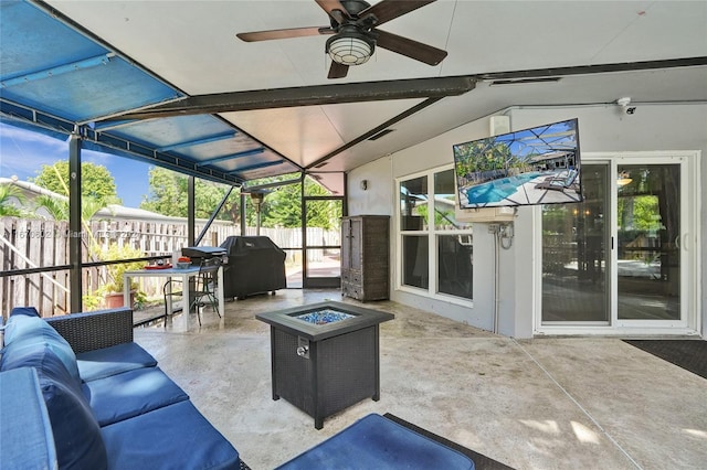 sunroom featuring ceiling fan and lofted ceiling