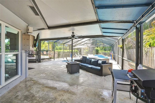 view of patio / terrace featuring an outdoor living space, area for grilling, and a lanai