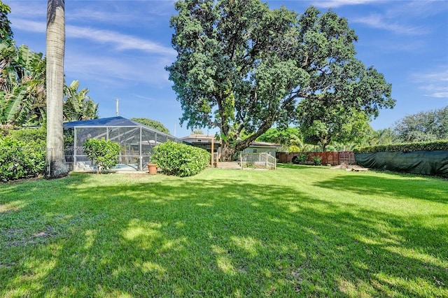 view of yard featuring a lanai