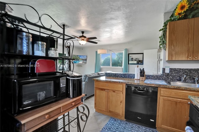 kitchen with backsplash, black appliances, sink, ceiling fan, and light tile patterned flooring