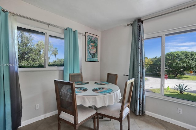 dining room with tile patterned flooring