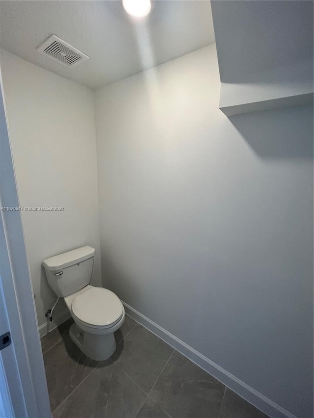 bathroom with tile patterned floors and toilet