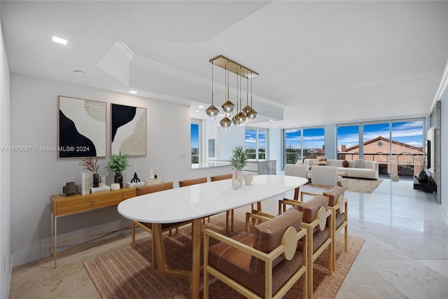 dining area with expansive windows and an inviting chandelier