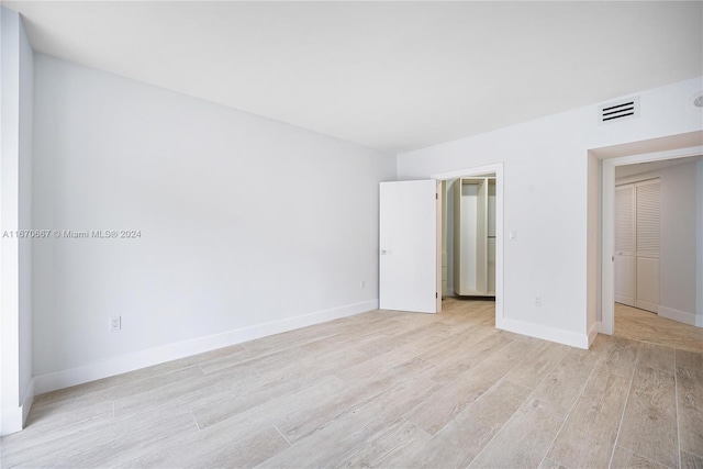 unfurnished bedroom with light hardwood / wood-style floors