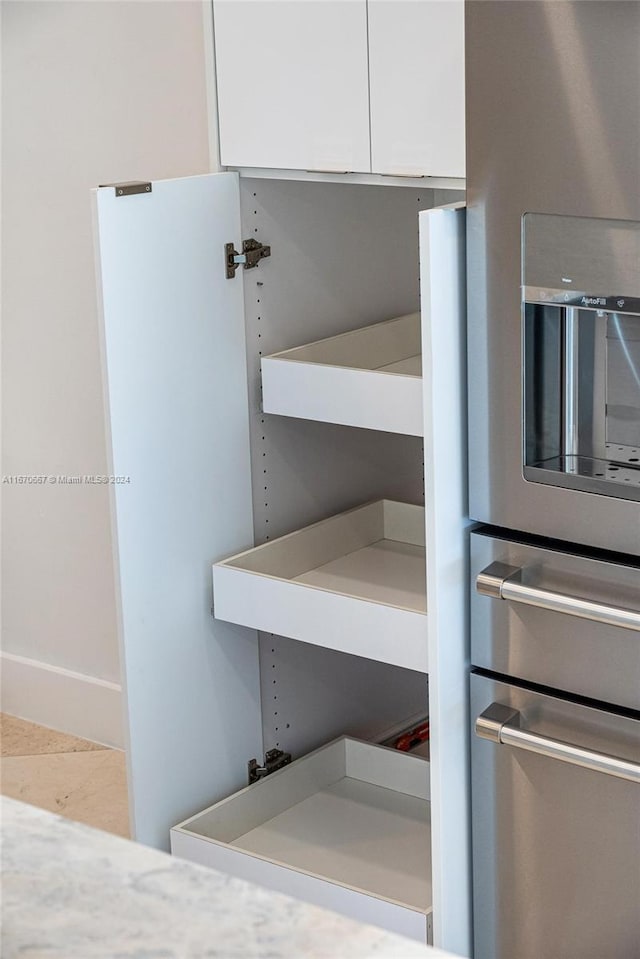 interior details featuring white cabinets