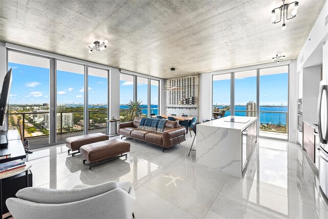 sunroom / solarium with a water view