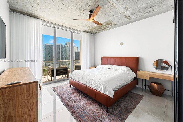 bedroom with a wall of windows, access to outside, and ceiling fan