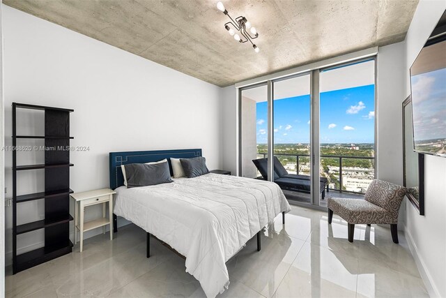 bedroom featuring access to outside and floor to ceiling windows