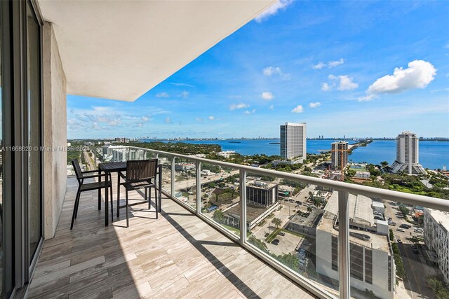 balcony featuring a water view