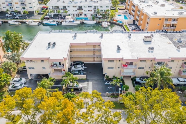 birds eye view of property with a water view