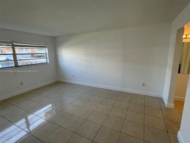 view of tiled spare room