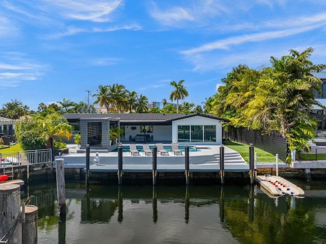 dock area with a pool and a water view