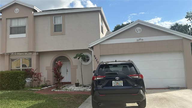 view of front of property with a garage