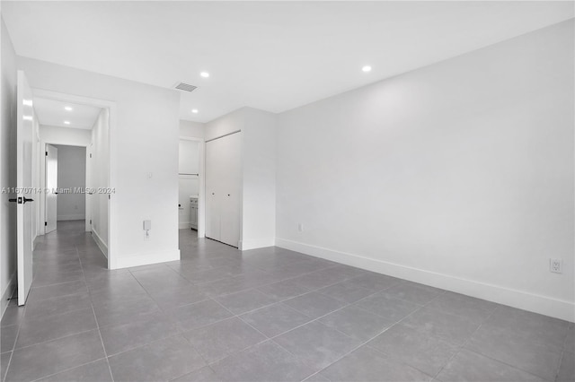 empty room with tile patterned flooring