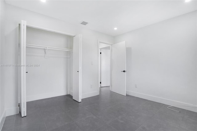 unfurnished bedroom featuring a closet