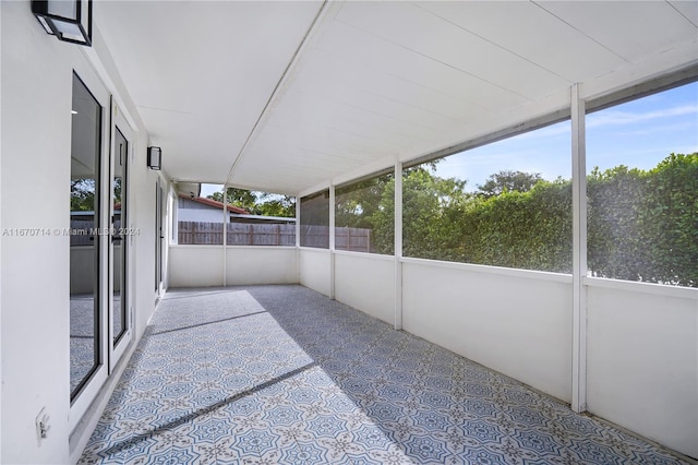 unfurnished sunroom with plenty of natural light