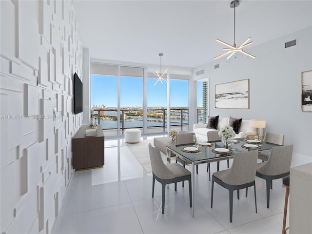 tiled dining room featuring a chandelier