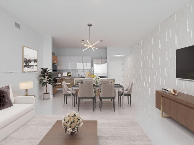 dining room with light tile patterned floors and an inviting chandelier