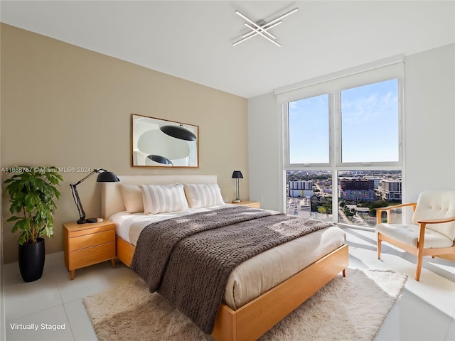 bedroom featuring light tile patterned flooring